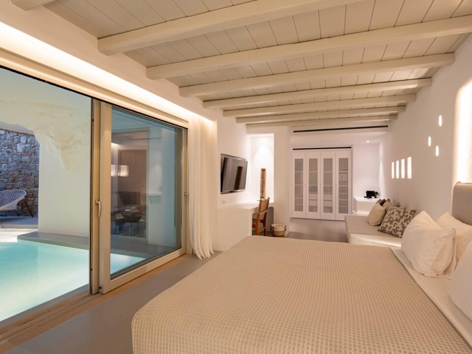 The Cave Pool Experience Suite: Sliding glass doors opening to a poolside patio
