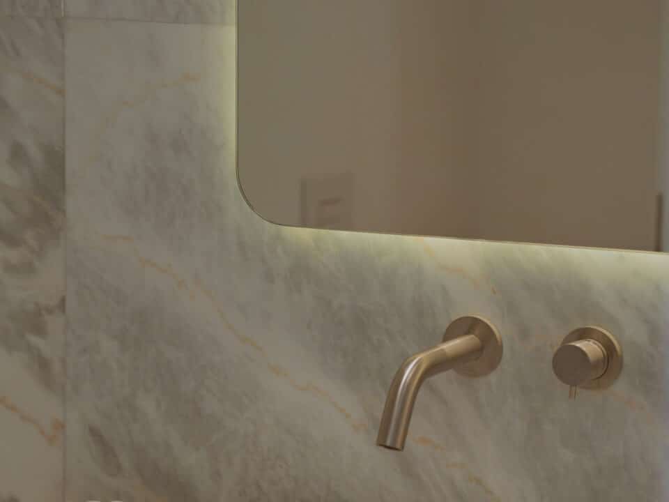 Junior Suite with Private Heated Swimming Pool: Bathroom sink with wall-mounted faucet and mirror above marble-look tile backsplash