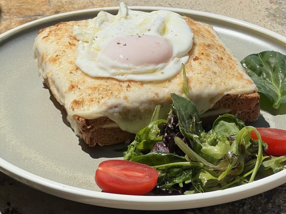 Nomia Mykonos Sunset Suites Restaurant: Croque Madame, served with mixed greens and cherry tomatoes