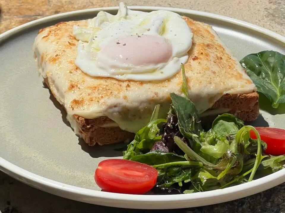 Nomia Mykonos Sunset Suites Restaurant: Croque Madame, served with mixed greens and cherry tomatoes